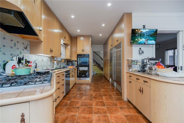 kitchen with backsplash, stainless steel appliances, extractor fan, sink, and light brown cabinets