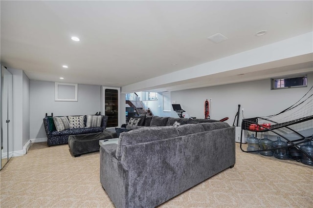 carpeted living room featuring a baseboard heating unit