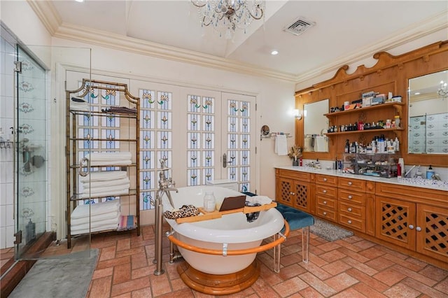 bathroom featuring vanity, french doors, crown molding, independent shower and bath, and a chandelier