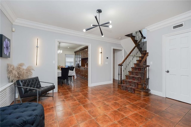 living area with a notable chandelier and crown molding