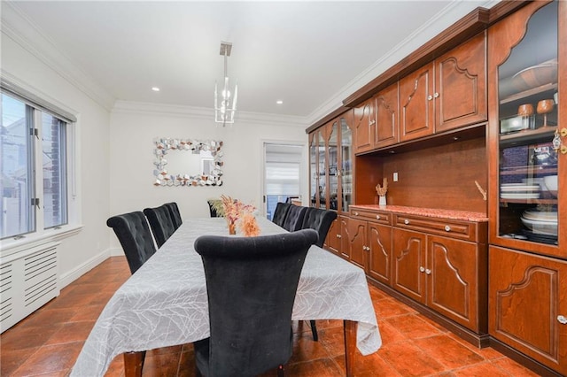 dining space featuring crown molding