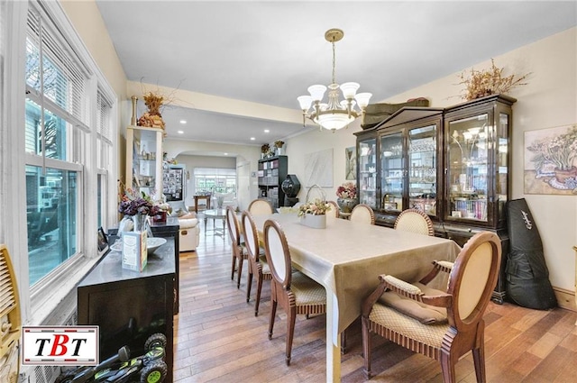 dining room featuring light hardwood / wood-style flooring and a chandelier