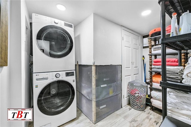 clothes washing area with stacked washer / drying machine