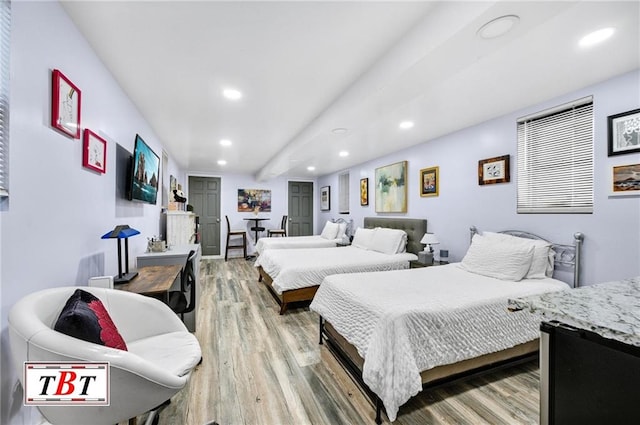 bedroom with wood-type flooring