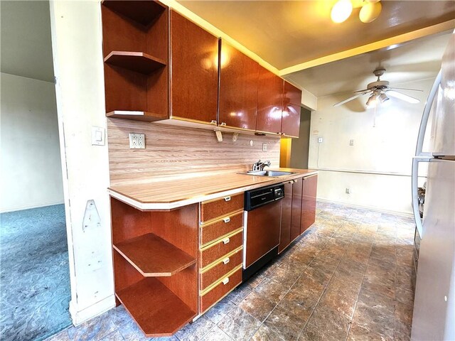 kitchen with stainless steel refrigerator, butcher block countertops, black dishwasher, sink, and ceiling fan