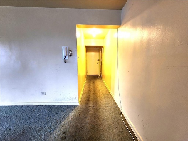 hall with carpet flooring