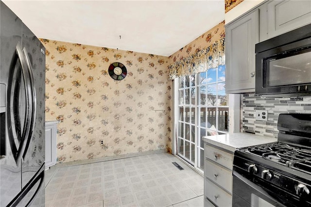 kitchen with black appliances and gray cabinets