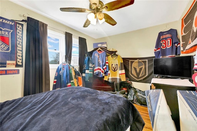 bedroom featuring ceiling fan and wood-type flooring