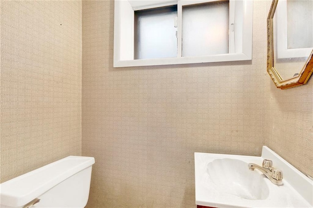 bathroom with toilet and vanity