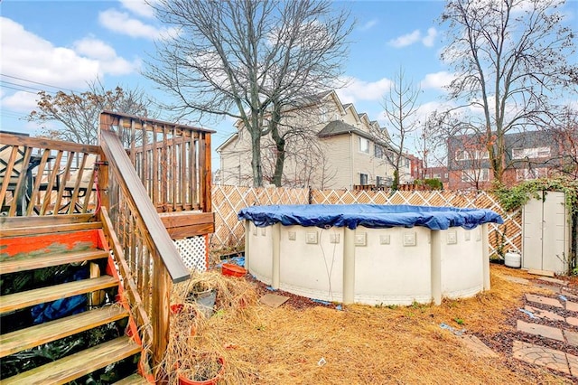 view of yard with a swimming pool side deck