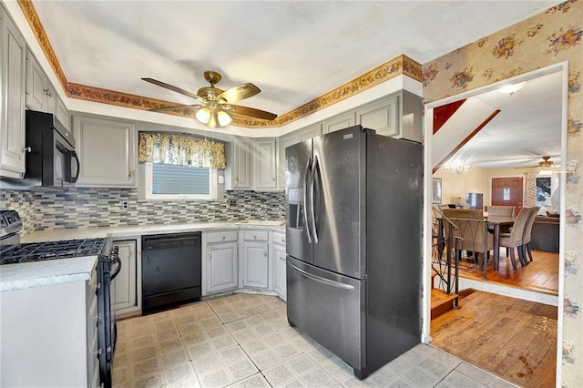 kitchen featuring black appliances, ceiling fan, decorative backsplash, and gray cabinetry