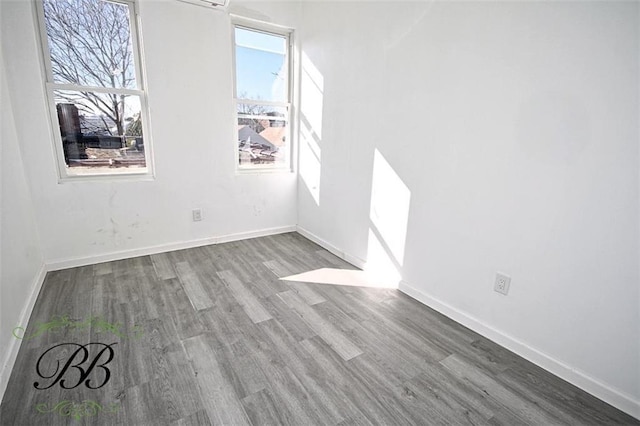 spare room featuring hardwood / wood-style flooring