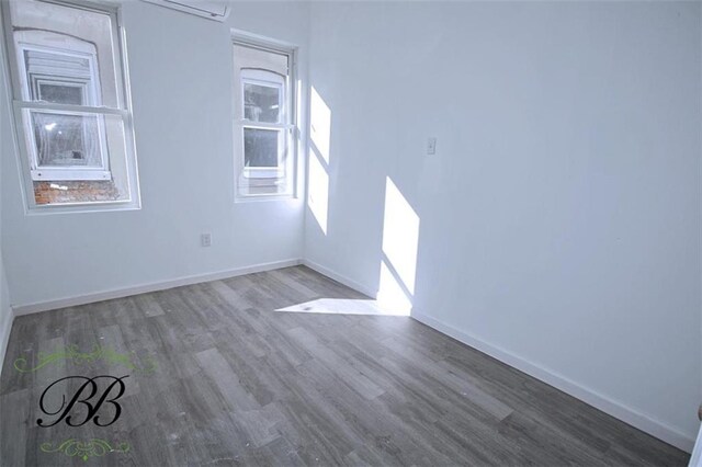 bathroom featuring an enclosed shower, vanity, hardwood / wood-style flooring, and toilet