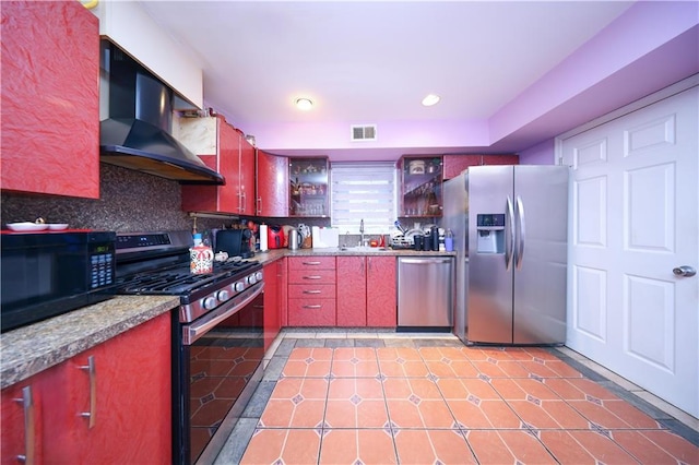 kitchen featuring tasteful backsplash, sink, black appliances, and ventilation hood