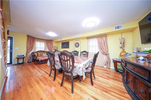 dining space featuring light hardwood / wood-style floors