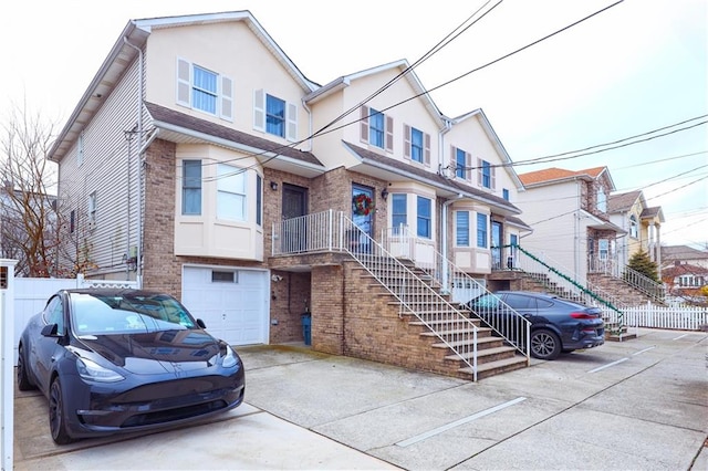 multi unit property featuring a garage