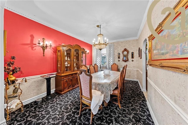 dining area with a chandelier, ornamental molding, carpet, and wallpapered walls