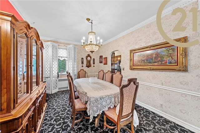 carpeted dining area with wallpapered walls, baseboards, a chandelier, and ornamental molding