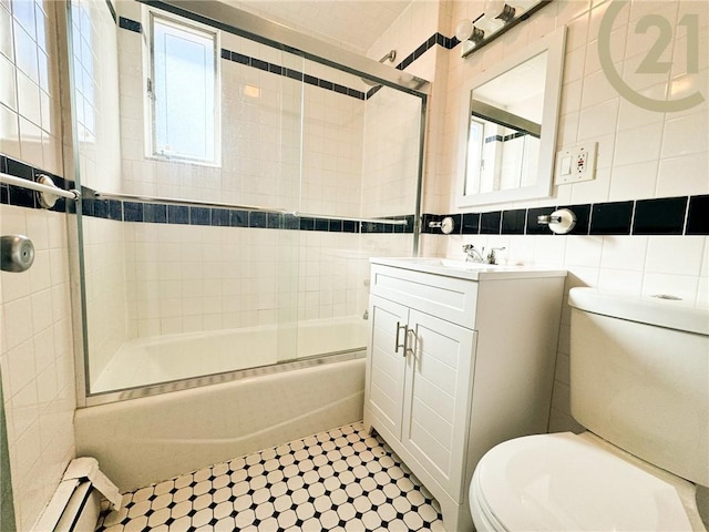 bathroom with toilet, tasteful backsplash, combined bath / shower with glass door, and tile walls