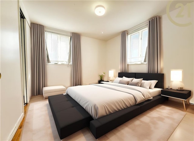 bedroom featuring baseboards, multiple windows, and light wood-type flooring