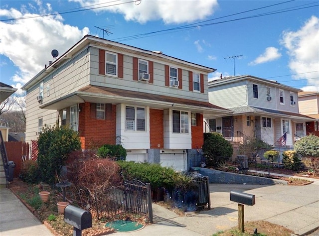 958 Clove Rd, Staten Island, NY 10301 - view of front of property with brick siding, a garage, and fence