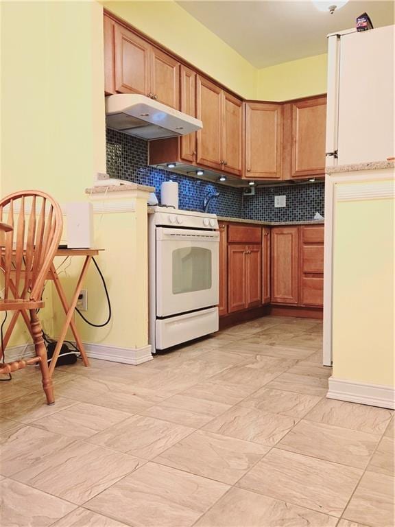 kitchen with decorative backsplash and white appliances