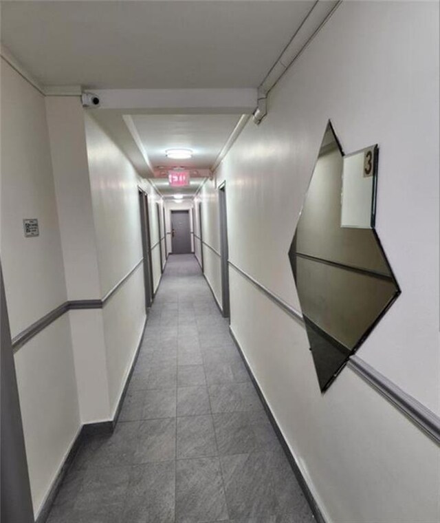 hallway featuring ornamental molding