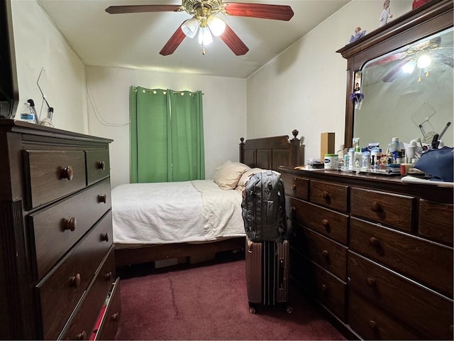 bedroom with ceiling fan and dark carpet