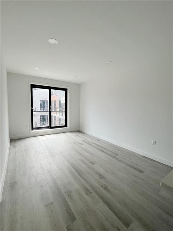 empty room featuring hardwood / wood-style flooring