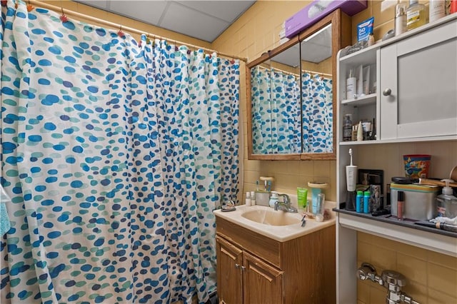 bathroom with vanity, a paneled ceiling, and a shower with shower curtain