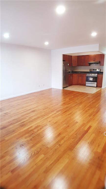 unfurnished living room featuring light hardwood / wood-style flooring