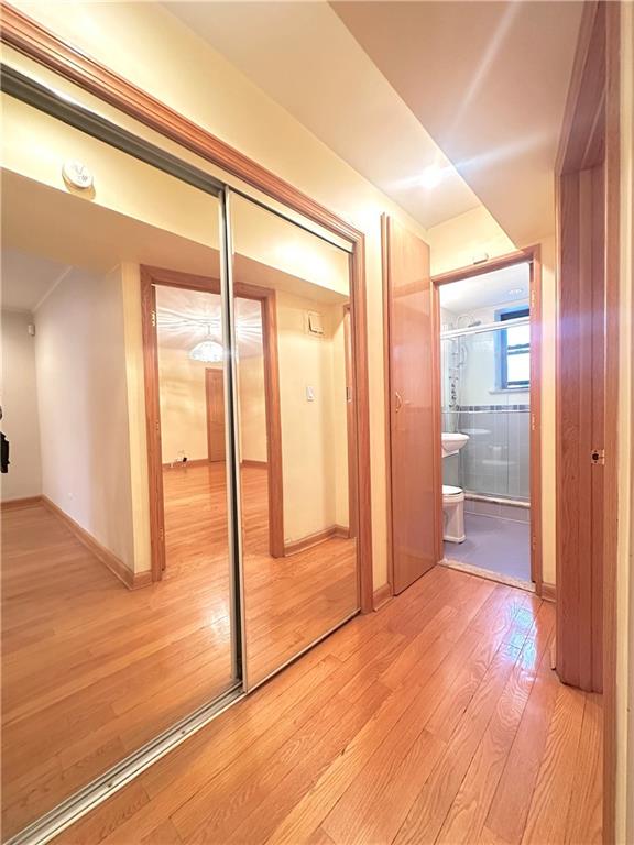 hallway featuring hardwood / wood-style floors