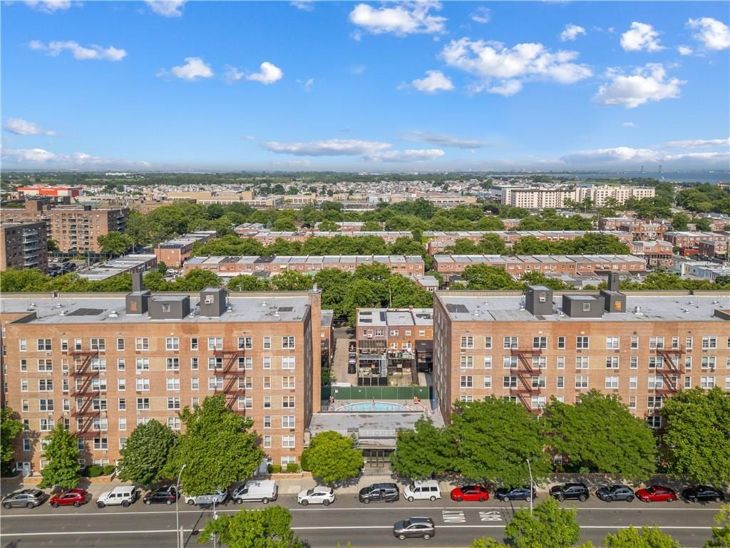 birds eye view of property featuring a city view