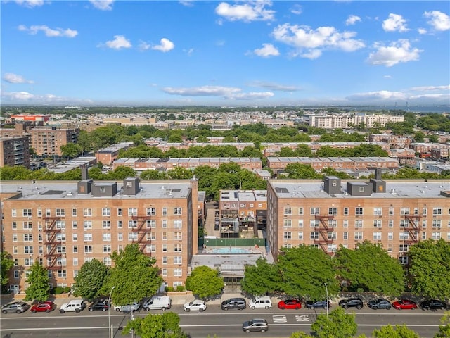 birds eye view of property featuring a city view