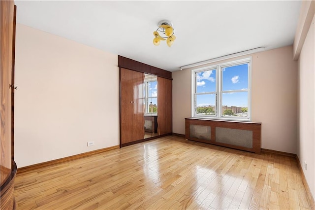 unfurnished room featuring light wood-type flooring