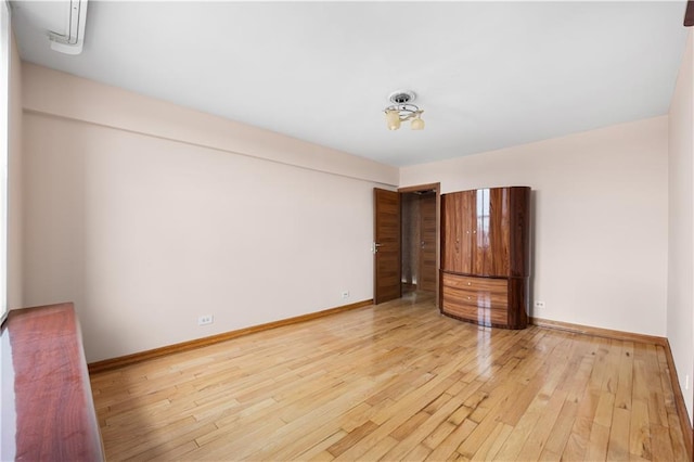 unfurnished room featuring light hardwood / wood-style flooring