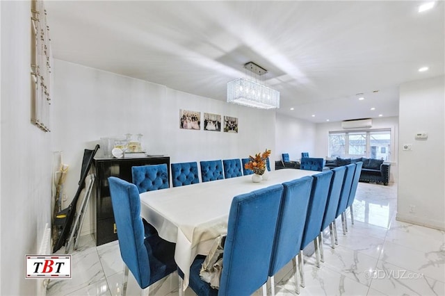 dining space featuring a wall mounted air conditioner and a chandelier