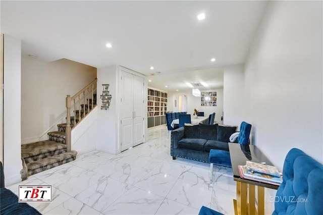1801 E 7th St, Brooklyn, NY 11223 - living room with stairway, recessed lighting, and light marble finish floors