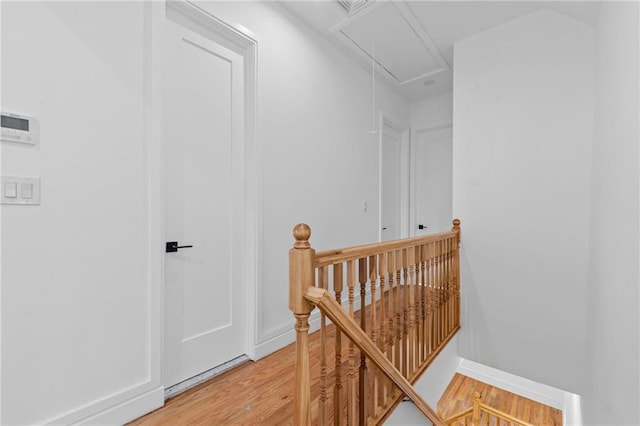 hallway with light hardwood / wood-style floors