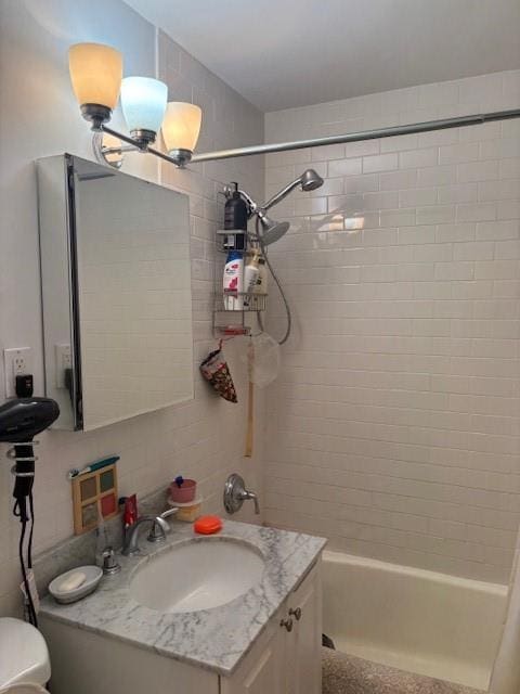 bathroom with shower / bathtub combination with curtain and vanity