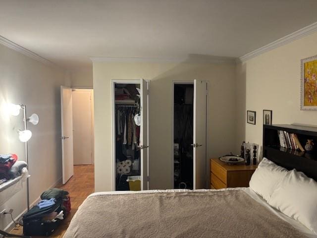 bedroom with a closet, a spacious closet, and ornamental molding