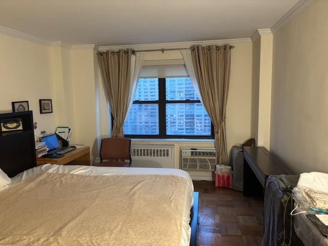 bedroom featuring crown molding, a wall mounted AC, dark parquet flooring, and radiator heating unit