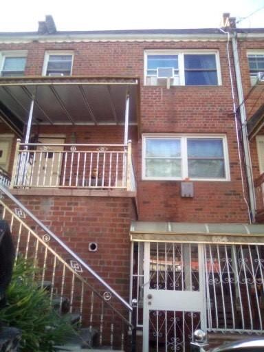 rear view of property with a balcony