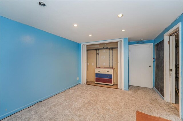 unfurnished bedroom with light colored carpet