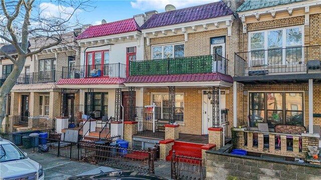 rear view of house with a balcony