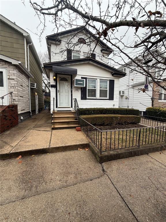 view of front of house with entry steps and fence private yard