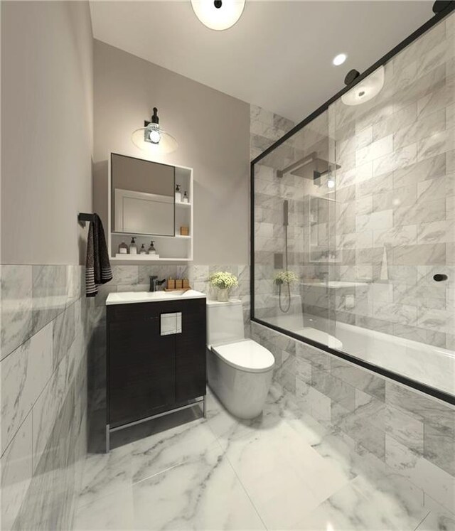 bathroom with vanity, toilet, tile walls, and walk in shower