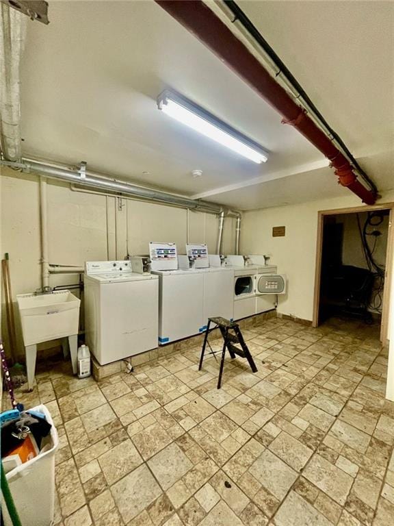 laundry area with sink and independent washer and dryer