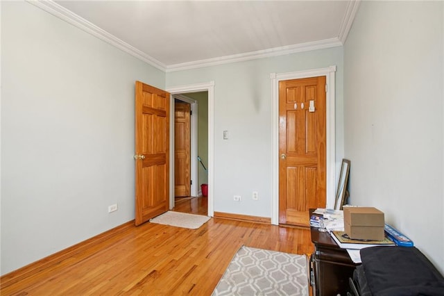 interior space featuring light wood-type flooring and crown molding