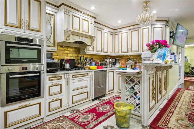 kitchen featuring stainless steel appliances, a notable chandelier, pendant lighting, decorative backsplash, and ornamental molding